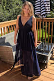 This dress was amazing. The color is a really pretty navy blue and it was perfect for a September wedding. I did have to shorten it, but that's to be expected for someone my height. I also had the straps shortened, but I also have a very short torso. Overall, I received a ton of compliments on the dress and it was very comfortable! Great material, and I love that it doesn't look like every other dress. Very happy with it! - Bianca N.