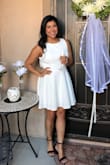 I NEVER shop for clothes online, but the dress was on sale and the previous reviews really helped my decision. The dress on the model is a lot shorter than I would want for myself, but I'm also 4 inches shorter than her. So the length was very comfortable for me. I bought it for my bridal shower, everyone loved it! The back was a little lose on me, but nothing really too worry about. The material is thick, I didn't need to wear a bra, but still wore pasties JUST IN CASE, but I really didn't need them. I was very happy with my first online clothing purchase! - Jordonnay H.