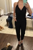 This jumpsuit is simple but super cute! Like most Lulus items, it is long, but as someone who is a long torso - I love that! It's easy to get things shortened. - Madeline B.