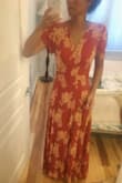 Omg!! This dress is so beautiful!!! The rust color is perfect for Fall!! So light weight & flattering!! Fabric hugs the hips perfectly with no extra fabric or weird bubbling which seems to happen in a lot of wrap dresses. So pretty & feminine!! I was able to throw on some high wedges & the hem line was perfect!! So excited that I don't have to get this shortened like I do every other maxi!! I bought this dress in both the navy blue & rust color!! Absolutely love it!!! Thank you Lulus!! - MaryBeth L.