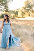 I LOVED this dress and got so many compliments on it. The dress fit a little tight in a medium, so I ordered a large instead and it was perfect. The color was true to the picture and it the slit is perfect. I had mine altered a bit so the straps were shorter and twisted. - Danielle G.