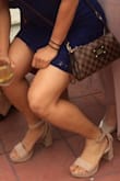 I never wear heels but had to purchase a cute pair to go with a dress I wore to a wedding. I avoid wearing heels whenever possible because I do not find them comfortable but since I was going to a friends wedding, I wanted to dress nicely for her big day. I decided to order half a size smaller since other reviews mentioned they fit a tad loose. I normally wear a women's US 7.5 but ordered size 7 and fit perfectly! I did not want them to feel loose in any way especially since I haven't worn heels in years. My only complain is that after a few hours the part where it clips begins to rub on my ankle and hurts but I fixed the problem by applying a clear band aid where it rubbed. Other than that, they were great! Here I am in a group photo, doing the squat pose! - Karla H.