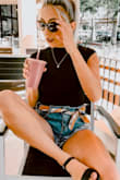 Not a lot of body suits can be comfortable (if you know what i'm talking about). Not only is this absolutely adorable but it is so comfy I almost forget that I'm wearing a bodysuit sometimes. The buttons behind the neck are easy to hook by myself and the buttons on the bottom are also easy to snap together! - Millie A.