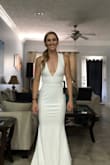 I'm so impressed with how this dress fits! I am between a small and a medium when it comes to pants and tops and the small fits perfectly! I will need to get it hemmed at the bottom and I might try to get it a little more fitted around the lower stomach. It's perfect! I'm not one to buy a very flashy and sparkly dress and spend a ton of money so this is just what I was looking for. I was afraid that I wouldn't fill out the chest as I don't have much to fill out :) It is very stretchy and comfortable. Definitely recommend. You can probably downsize if you are between sizes since the material is stretchy. - Katrina K.
