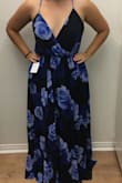 The dress is a beautiful blue color. I purchased it for an upcoming wedding; however, I couldn't get the fit to work. I sized down based on other reviews, but it still wasn't perfect. I was able to adjust the straps, but I felt that the dress had too much material making it unflattering on my figure. Also, it was quite long. Unfortunately the dress didn't give me the wow factor I was hoping for, so I had to return. - Mary A.