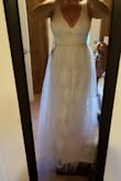 This is a sweet dress. The color is a little more beige than the photo depicts but has a vintage look to it. I'm only 5 ft so it will have to be hemmed about 9 inches but the quality and weight of this dress makes it look expensive. - Renea P.