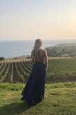 Ordered this dress for my brothers wedding. The material is a little thick and it was a hot day in august but was still very comfortable. Had to get it hemmed. Received multiple compliments. Must have dress for every body type! - Chelsea S.