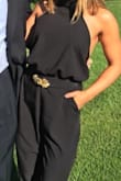 I love this jumpsuit! Thankfully I didn't buy an extra small because the waist is about 26 inches and of course I had to hem it since I'm short. I was worried about the awkward situation of going to the bathroom but there is a zipper on the back of the pants and I could wiggle out, it's still a little awkward but better than getting fully undressed. - Kim M.