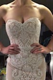 This dress fit even better than I thought it would. I was a little worried because the product info says fits A-C cup and I'm a DD, but it fit perfectly even with a strapless bra. The boning holds the dress up pretty well and the quality is definitely above the price point. It is realllyyyy long but that's to be expected on me. My only complaint is that the lace is so thick it prevents the zipper from moving freely so it was a struggle to zip up where the bodice meets the skirt part. - Krystle H.