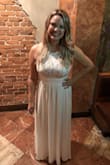 I got so many compliments on this dress! I'm tall and have a tough time finding dresses that are long enough. This one went right to the floor with a heel! 

I'm a little wide up top so it was a little tight up top but not uncomfortable. - Christina K.