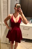 The color of this dress is beautiful! The material is comfortable and stretchy. I especially love the fitted skirt underneath. My only tiny complaint are the outside straps that go over the shoulder and next to your underarm. They are a little awkward and tend to roll outward when you move your arms. They are tight so they don't slide completely off your shoulder but it is kinda of uncomfortable to keep adjusting BUT don't let that detour you from buying this dress! Can't wait to wear this! - Nicole I.