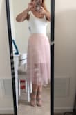 This bodysuit is so cute! I bought the white one to wear to my bridal shower. It is so soft and the size fits perfect! I wore without a bra and it was not see through. - Adrienne B.