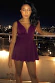 Bought this for my birthday dinner and it was absolutely stunning in terms of fit. The deep V-neck is structured with this light wire so no need for a bra or anything. Only thing is that the picture depicts an 'ox blood red' and it's more of a purple in person. - Joy N.