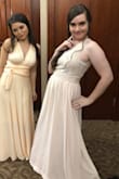 I wore this dress as a bridesmaid in an early September wedding. I was initially attracted to the design of the lacy top, which was even prettier in person and definitely my style. I usually wear a small, but I ordered a medium for this dress and I'm extremely glad I did. It was tight but not uncomfortable from shoulder to waist, though the zipper loved to get stuck right where "top" ends and the "dress" begins. This dress was WAY too long (and I'm not petite), though I've read in other reviews that Lulus dresses tend to run long so I was kind of expecting that. I guess that's awesome if you're tall, but I had to have it hemmed about 2 inches (I am 5'5" and wore one-inch wedge sandals). The seamstress had some issues with this because the original hem (on the top layer - there are three layers of fabric in the bottom part) was very uneven. It's not something a layperson would notice or be looking for, but if you need to get this dress altered, be aware that the hem will probably not be even and this may cause some issues. The lovely lady on my right (your left) in the photo is wearing Lulus "Tricks of the Trade," also in blush pink, but you can see that the dresses are not the same color. Hers was much more peachy. The dresses are different materials, which is probably the cause of the discrepancy. I'm about to meet my word limit so I'll just say that despite the issues I ran into, this dress was pretty and I had fun dancing in it! - Devon W.