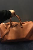 Love it! It looks just how it does in the photos, the strap is super cute and it fits a good amount in it. It's the perfect travel bag! - Jerica Y.