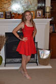 Fitted through bodice and an adorable flair skirt. Great for homecoming or any special occasion. - Ruth C.
