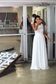 I would normally wear a XS but other reviews said to size up... I got a Small and it fit perfect ! It was long but not enough to get it fixed ! The material had about 3 layers so it wasn't see through and the top part had a nice floral design. The dress was used for my 5 year Vow Renewal and it was so beautiful. I have had SO many compliments...! This dress was just enough but not over the top fancy. It made me feel beautiful. I would recommend this to anyone from Prom to Weddings! Love it! - Samantha M.