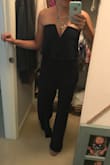 I am obsessed with this jumpsuit. It fits like a glove! It stays put and didn't slip down all night even when I was dancing and holding my 2 young kids. I did have to have a few inches hemmed because I only wanted to wear 2 inch heels. So it definitely runs long but is otherwise TTS. Highly recommend this! - Krista D.