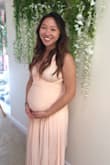 I bought this to wear for my baby shower. The length was just short enough that I could get away with flats. I would probably wear some short heels next time because it was difficult going up/down stairs with it. I wore it more Grecian style like the photo and it was lovely! Got a ton of compliments on the dress and it was super comfy to be in all day. Going to the bathroom was a little tricky because you don't want to accidentally let the remaining ends fall in the toilet... Also another tip: wear a GOOD pasties. I had to double up on band-aids because this color is very see through. - Mira K.