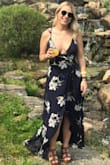 I loved this dress, but it definitely takes a little help to get on. There are ties that run through the inside and around you just to get it on. I also have a larger top area so it was a bit more revealing than I anticipated. Still very very cute! - Kylie W.