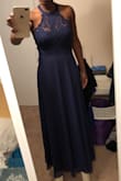 Absolutely loved the material, it's made with quality so it hangs nicely on the body. I ordered a medium, and the lace was a little loose on my back. And I would have preferred closer fit around my neck. So had to exchange for a small. - Ciara W.