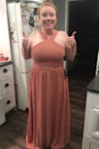 Bought this for a wedding I'm in. Feels like good quality fabric. I bought an XL and it fits just right, albeit rather long, but I'm 5'2" so that's nothing new. I'll just hem it. - Stephanie F.