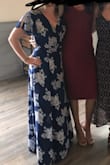 Loved the dress. Perfect balance of casual and formal. It is a wrap dress so there was nothing keeping it together except to ties around the waist. I had to pin it on my upper leg so it didn't just fly all the way open with the wind. I also had to pin it on my chest as there was a little too much space there but since I am a smaller cup size this is a common problem for me with dresses. - Charissa G.