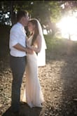 I used this dress as my wedding dress and could not have been happier. The lace is amazing quality, with an opalescent stitch to highlight the lace accents. The dress is very long if you are short like me. I ordered the Small which fit my hips perfectly but I needed to take in the top about two inches but it was an easy alteration my mom was able to do for me. I wore 6 inch heels instead of hemming to preserve the beautiful trumpet base. - Heather J.