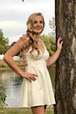 Bought a medium thinking it might be a little big but it fit perfectly! I got this in white and the fabric was thick enough it was not see through and just what I wanted! - Dawn R.
