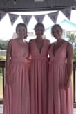 I got so many compliments on this dress when I wore it last weekend for an outdoor beach wedding. It's flattering on all colors, shapes, and sizes. It does however run very long and a little loose in the chest area. I ordered a size small and had to get it hemmed to be shortened a few inches and taken in under the armpits as well as the other girls in the bridal party which cost an extra ~$60 since there are 3 layers. Even with heels on and hemmed, we were tripping over it a bit. Still, worth it and happy with the purchase! Pretty dress! - Lauren N.