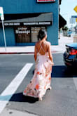 This dress was beautiful. I wore this to a summer wedding and received a lot of compliments. It flows very gracefully when you are walking. I am short and petite (5'2"), and ordered an XS, and would caution that this dress has A LOT of fabric & it was incredibly long even with wearing heels. I got it tailored (hemmed) because I loved the feel of it so much. Attaching random pictures my friends took. - Vicky K.
