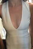 I ordered 5 white dresses in order to choose my favorite, and this one ended up being my second favorite. It really is gorgeous - I think the photo here doesn't do it justice because the model is doing a weird sidestep, where in reality it looks more elegant than that. The reason I didn't choose to keep it, though, is because the criss-cross straps were too wide and there ended up being too much fabric between my neck and shoulders, so I'd only recommend it to someone with broad shoulders. Also, the open back is very sexy, but I thought that the stretch material that runs across the bottom back looked kind of cheap. Other than those issues, it was beautiful and I wish I could have kept it. - Leila M.
