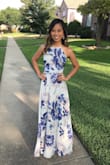 I purchased this in the Grey Floral print and absolutely love it! I had to get the dress hemmed (since I'm super short!), but other than that it fit perfectly. It's flowy and the colors are beautiful together. I wore this to a wedding and got lots of compliments. - Hallie T.