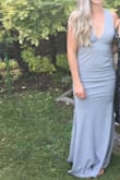 Amazing dress! Fits snugly, which is a good thing because it's got a fairly low v-neck in the front and a very love back so really wouldn't be able to wear a bra. Comfortable, stretchy, and great gray color! Wore to a wedding on the French Riviera and got lots of compliments. Recommend!! - Mackenzie A.