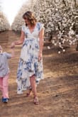 I ordered this dress to take spring pictures with my son and I couldn't be more pleased with how they turned out. This dress is absolutely breathtaking. I felt beautiful and sexy all in one. The neckline comes down a little low, but I just pinned it for the photos (I didn't want to show too much), but for any other occasion it won't be a problem for me. - Ashley H.