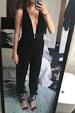 The material is soft and cozy! I'm shorter, but the ankle tie is adorable and it fits more like a full length jumpsuit, not cropped like seen in the picture of the model. It's kinda wrinkly but after ironing it was so cute!!! - Erin D.