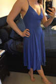I love this dress! It is so pretty, so flattering and so fun! The spaghetti straps and open back make it sexy, but the full skirt and midi length keep it casual. It's an extremely flattering fit; my ONLY complaint is that the straps do dig into your shoulders as you wear it and it requires a bit of constant adjustment in that area. I'd still recommend it to everyone! - Lara S.