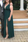I wore this to my sister in laws wedding and got so many compliments. The green is deep and vibrant (went really well with my pale/redhead complexion). I did have it hemmed to my heel height and the top tailored to my frame so there was no exposure whilst dancing. Can't wait to wear this for years to come! - Kathryn A.