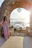 I wore this to watch the sunset in Mykonos at an especially nice venue where apparently all the women get decked out to watch the sunset. It was perfect! I got so many compliments, it contrasted nicely with the setting, and (more importantly) looks gorgeous in the pics.
The dresses material is soft, the design is just like it's pictured, and the length on this dress was perfect for my height plus 2 inch heels. I will say though that it's probably better to wear a bra with this dress (I ordered one of those plunge, sticky, silicone bras off of Amazon, and it worked beautifully).
Get this dress! It is gorgeous, and you will love it! - Hong N.