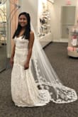 I loved this dress, but I ended up going with another Lulus dress. If you have a tight budget, this dress is for you. I would recommend getting a mermaid slip to give it more shape (see picture). Also, this dress doesn't stretch, so that's something to take into consideration. When I brought it to the bridal store to get my veil, they actually thought the dress was from their store, so that speaks to the quality of the dress. The underlay is nude and the dress is slightly off white. I would've also needed to get it hemmed if I had gone with the dress. - Libriel P.