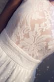 I absolutely love this dress! I can't wait to wear it for my bridal shower! The material is heavy below the waist, but I personally do not mind. The top is more beautiful in person. - Ashley J.