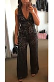 This jumpsuit is soo pretty and fit perfectly. I am just under 5'4", so I worry jumpsuits may be too long on me, but this was perfect with heels and didn't drag on the floor at all. I was pleased that I could wear a regular bra under it too. The V-neck doesn't dip too low. The lace is beautiful and seemed to be pretty well made, although I dry cleaned it and the lace started to unravel. It didn't look damaged, so I just snipped the strings. I wore it to two different October weddings and was thankful for the pants to help keep me warm. I received tons of compliments and plan to wear it again around the holidays! - Liz Z.