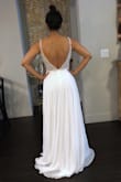 I ordered this dress to wear during my wedding reception since the dress I picked for my wedding is heavy and a little uncomfortable (to be honest).. Having paid 2k for wedding dress I had pretty low expectations of how a 250 USD wedding dress would look and feel... I could not believe the amazing quality of this dress when I opened the package, it's totally comparable to dresses I tried at bridal shops for 1.2k 1.5k. The beading of the top of the dress is so well done and detailed, it reminds me of a Morilee dress I tried when I was searching for dresses... The layers of the bottom are super delicate and the dress falls perfectly. I Love the material and the detail of the see-through top. The color is perfect (Ivory / off-White). I ordered a size 2 and it fit me perfectly, I will only have to get the hem fixed since I'm only 5'3". I wish I would have ordered this dress before buying the dress I will wear during my ceremony... after trying this dress I realize it was so perfect that I could have wore it for my ceremony as well...You really feel like you are wearing a high quality, well done dress from a high end designer. I freaking love this dress!!!! Thanks Lulus. - Thaly L.