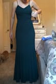 This is a very form fitting dress however it has 2 slightly thin layers allowing you to still move around comfortably, instead of being stiff. The length of the dress is PERFECT for me & I typically have to get dresses hemmed because they are always too long. Lastly, the color of the dress was a little less vibrant than I was expecting but still beautiful. - Krystle P.