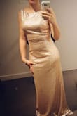 I wore this for my brother's wedding. With the reviews and the sizing chart, I was able to decide on getting a medium and it fit absolutely perfect! The only thing I had to do was get it hemmed as it was made for a model who was 5'7" but otherwise it hugged my curves in all the right places. It was beautiful. I felt like royalty and the quality was great too. I was pleasantly surprised. The pictures don't do it justice. - Sherrie R.