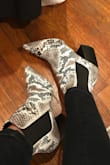I liked the look of these boots but decided I wanted a more muted/warm toned snake skin print. I am usually size 8 98% of the time and these boots were a bit big with a thin/normal sock. I also found them to be very structured and hard. I can't decide if they would've been comfortable to wear out for the day. Overall they were a cute bootie, but I opted to return and try a different style. - Ali K.