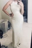 I really like this! I just bought it on a whim because it was on sale and now it's serious contender as my wedding dress! I got a medium and it fits well, I am getting it tailored a bit as it's too long and I might get the adjustable straps replaced. I'm a little smaller on top so I had to tighten the straps almost all the way to get it to lay flat against my chest. The ribbon detail at the waist is a little tight and hits me in an awkward spot above my natural waistline, kind of around the bottom of my rib cage. It's a little tight around the hips on me but I love it because my booty looks amazing! I will be wearing light shape wear with it just to make myself feel more contained and smooth though! - Katrina M.