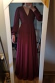 I have broad shoulders and long arms so I was hesitant to buy a long sleeved dress. The sleeves are a perfect length, I didn't have any trouble getting my hands through the fitted wrists, and I have full range of motion in the shoulders/back. This dress is perfect. High quality, thick fabric on top and bottom, sheer sleeves. Beautiful darker burgundy color. Very flattering in the back. If you're between a small and a medium, buy the small. It has plenty of adjustment room. It's long so I will have to get it hemmed. 10/10 I would recommend. - Allison O.