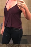 Shirt is made of great quality and soft material. It's longer in the back and a little too short for me in the front but if you wear it with high-waisted jeans it doesn't look awkward. I also like that you can wear a bra with it without it showing. - Jenn S.