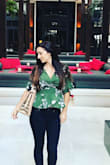 This top is sooooo cute. I love the peplum and wrap style. I have a long upper body so it was a little short on me but not so much that it looked weird. This would be cute with anything high waisted as well. It's a great material and I got a lot of compliments. - Sarah P.